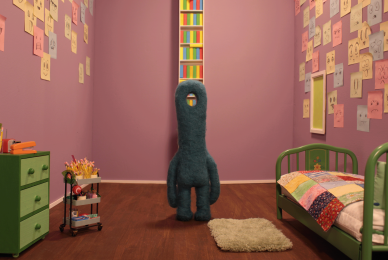 animated faceless creature in childhood room with pink walls